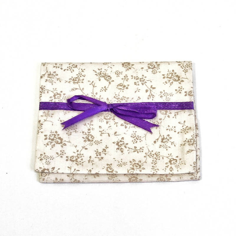 Tissue pouch with ribbon